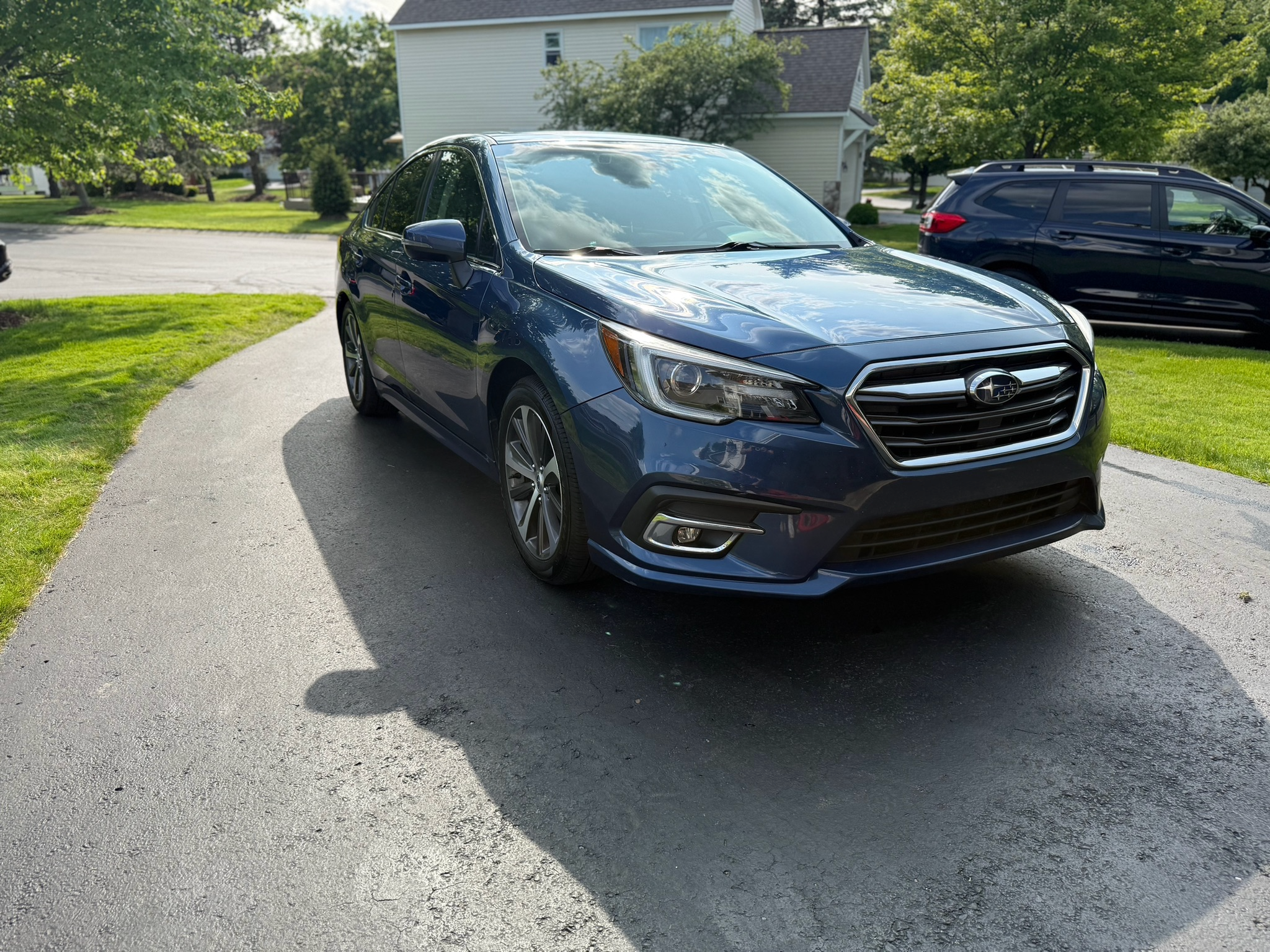 Professional exterior car wash and wax on a sedan
